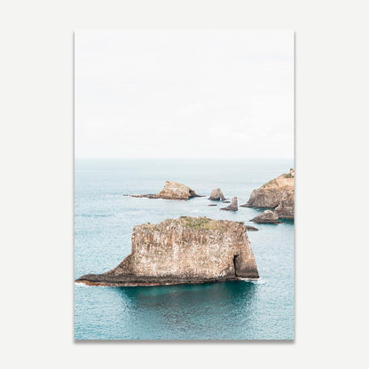Serene Coastal Landscape with Majestic Rock Formations and Tranquil Waters