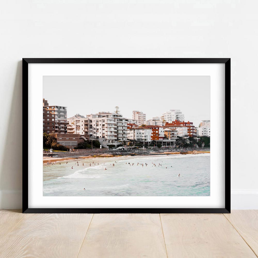 Serene Cronulla Beach Scene with Coastal Waves and Urban Skyline