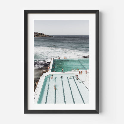 Serene Ocean Poolside Retreat with Bathers and Majestic Waves