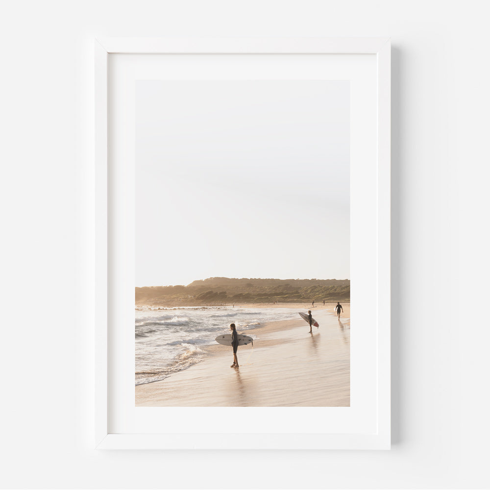 Tranquil Beach Scene with Surfers Embracing the Ocean's Rhythm