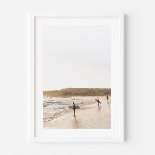 Tranquil Beach Scene with Surfers Embracing the Ocean's Rhythm